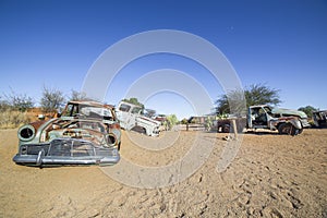 Abandoned vintage cars in Solitaire, a lonely settlement in Namibia photo