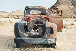 Abandoned vintage rusty pickup truck car wreck in the desert, Rhyolite, Death Valley National Park, California, USA.car wreck in