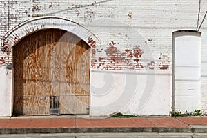 abandoned warehouse building boarded up loading dock bay door