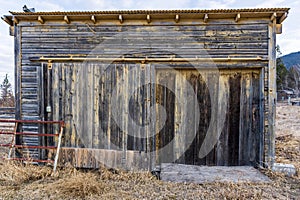 Abandoned weathered barn, close-up view rustic wall