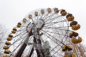 Abandoned wheel of view in pripyat city ghost - town in exclusion radioactiv zone Chernobyl Ukraine. Nuclear dirty place