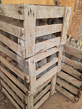 Abandoned Wood Pallet With Bottles Inside