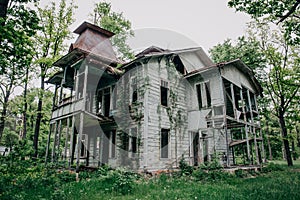 Abandoned wooden antique vintage mansion