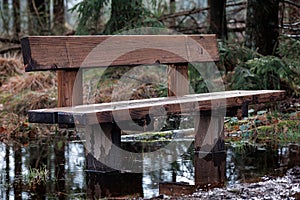 An abandoned wooden bench, flooded by climate change