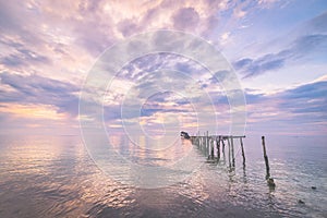 Abandoned wooden jetty at dusk, toned image