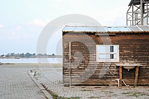 An abandoned wooden old house, desolation and ruin, an old village house by the sea