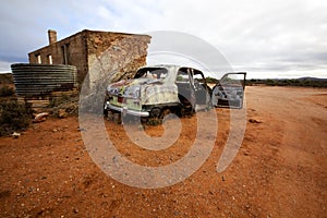 Abandoned Wrecked Car and House