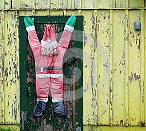 Abandoned Yellow House with Strange Santa Claus