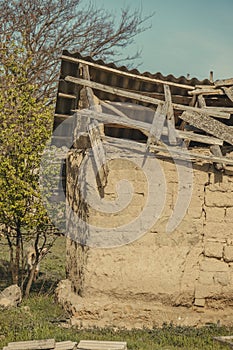 Abanoned old traditional house in ukranian village with damaged roof