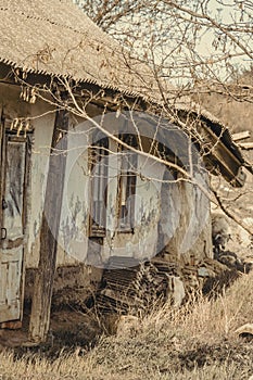 Abanoned old traditional house in ukranian village. Slanted walls, rural devastation