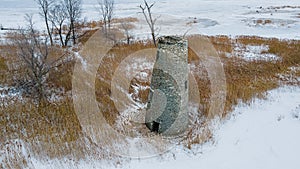 An abanoned ruined lighthouse in winter