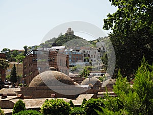 Abanotubani - ancient district of Tbilisi, Georgia, known for its sulfuric baths. The roof with dome of red brick of steam rooms.