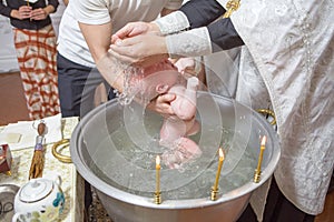 Abbe blessing a little infant kid in baptism christening cerem