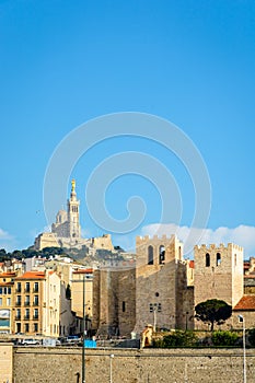 The abbey of Saint Victor and the basilica of Notre-Dame de la Garde at sunset in Marseille, France