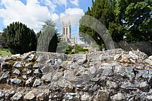 Abbey wall ruins in focus with St Edmundsbury Catherdral
