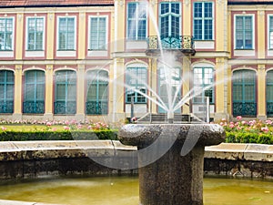 Abbots palace in gdansk oliva park. building with fountain