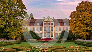 Abbots Palace in the rococo style and located in Oliwa Park in autumn scenery.