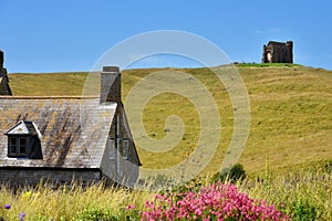 Abbotsbury village, Jurassic Coast, Dorset, UK. Cottage in countryside with St Catherine\'s Chapel on background