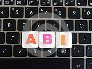 Abbreviation ABI on keyboard background