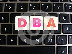 Abbreviation DBA on keyboard background