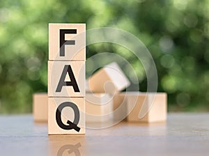 Abbreviation FAQ on cubes with a bunch of wooden cubes in the background