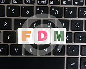 Abbreviation FDM on keyboard background