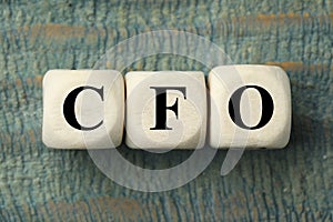 Abbreviation HCM Human Capital Management made of cubes on blue wooden background, top view