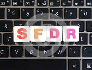 Abbreviation SFDR on keyboard background