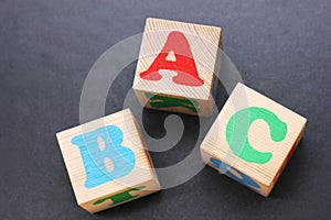 ABC -the first letters of the English alphabet on wooden toy blocks