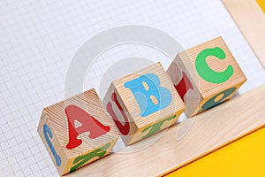 ABC -the first letters of the English alphabet on wooden toy blocks . English for beginners concept