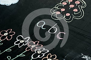 Abc letters chalk drawing on blackboard selective focus macro