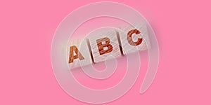 ABC letters on natural wooden blocks. Elementary school education concept