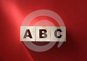 ABC letters wooden blocks on red. Education concept