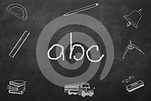 ABC letters written on a black chalkboard