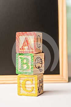 ABC Wooden blocks against chalkboard