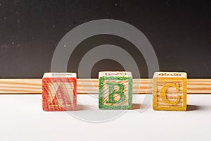 ABC Wooden blocks against chalkboard