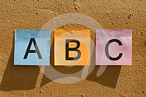 ABC word from colorful paper notes on wall