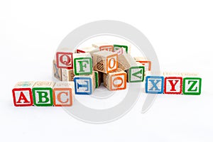 ABC and XYZ alphabet blocks isolated on white background. Preschool and education concept photo