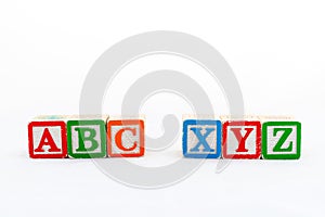 ABC and XYZ alphabets wooden blocks. Selective focused with copy space photo