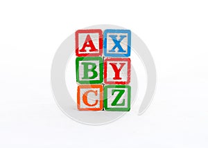 ABC and XYZ blocks stacked and isolated on white background photo