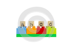 Abcd word on wood stamps and colorful toy blocks photo