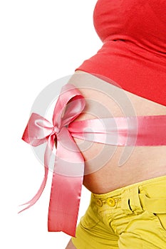 Abdomen a young pregnant woman tied with a Red rib photo
