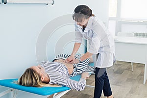 Abdominal examination, Doctor is examining the abdomen of patient