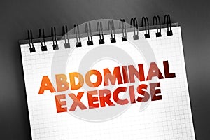 Abdominal exercise - type of strength exercise that affect the abdominal muscles, text on notepad