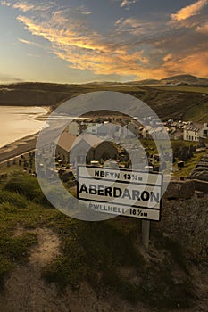 Aberdaron road sign in evening sunlight. Aberdaron is on the coast of the Llyn Peninsula in Gwynedd photo
