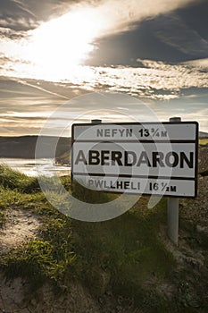 Aberdaron village road sign in evening sunlight. Aberdaron is on the coast of the Llyn Peninsula photo