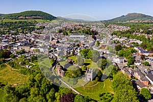 ABERGAVENNY, WALES - MAY 14 2022: Aerial view of the Welsh market town of Abergavenny, Monmouthshire surrounded by green fields