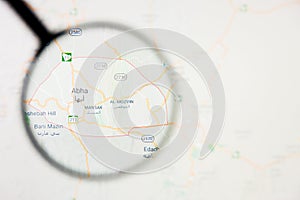 Abha city in Saudi Arabia visualization illustrative concept on display screen through magnifying glass photo