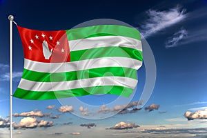 Abkhazia national flag waving in the wind against deep blue sky.  International relations concept