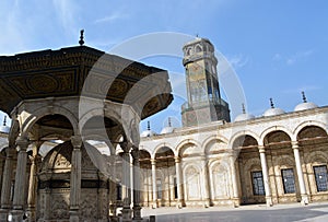Ablution fountain and the clock tower in courtyard of The great mosque of Muhammad Ali Pasha or Alabaster mosque at the Citadel of